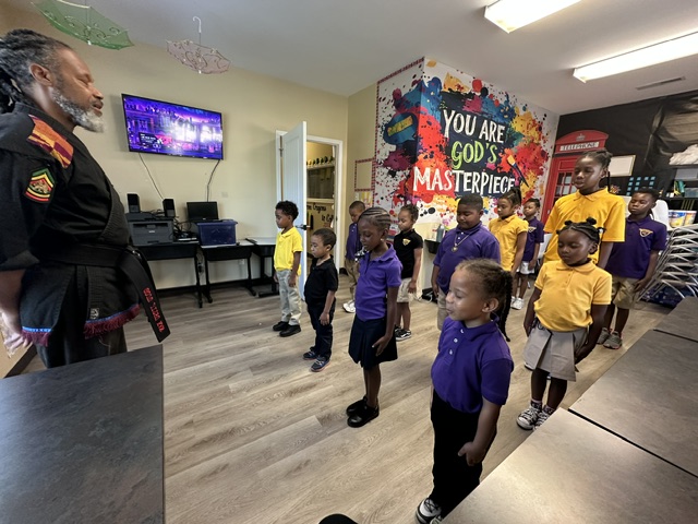 Students Standing in Classroom